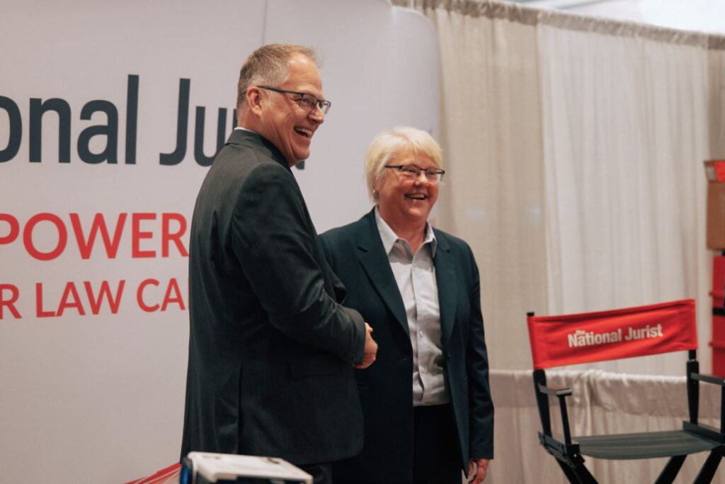 Jack Crittenden & Kellye Testy shaking hands